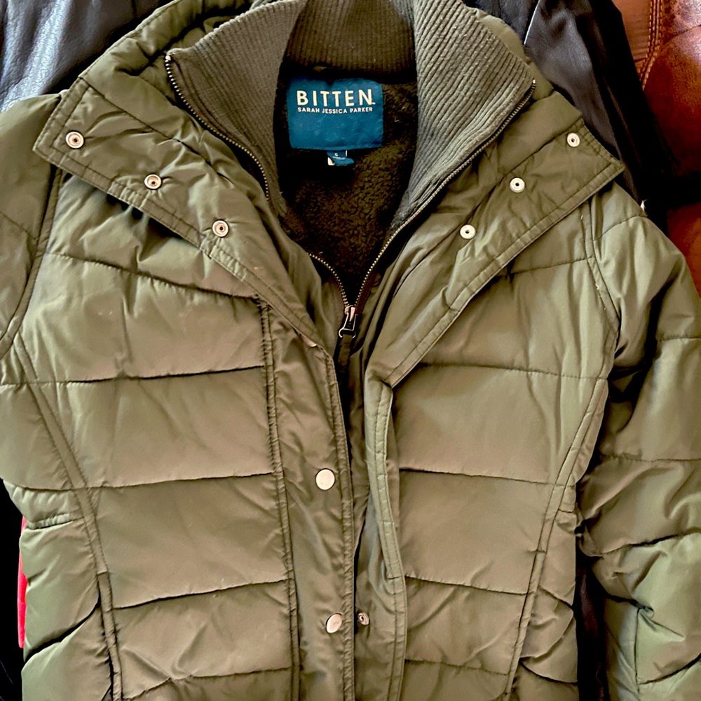 Warm green winter jacket. Puffer on outside, extra ribbed layer on inside.